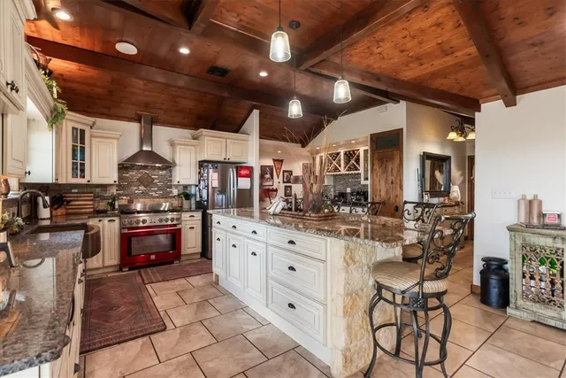 a kitchen with stainless steel appliances granite countertop a sink and cabinets
