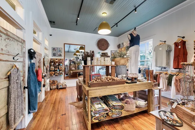 a very nice looking room with lots of stuff and hardwood floor