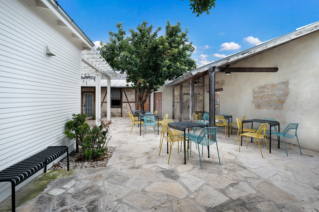 632-636 High Street Comfort, TX 78013 - Photo 20 of 56 a view of a patio with table and chairs and potted plants