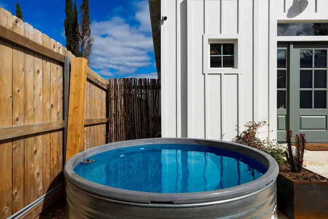 a bath tub sitting in front of a house