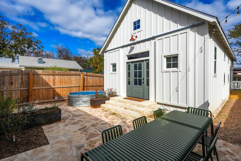 632-636 High Street Comfort, TX 78013 - Photo 26 of 56 a view of a patio with couches table and chairs and potted plants