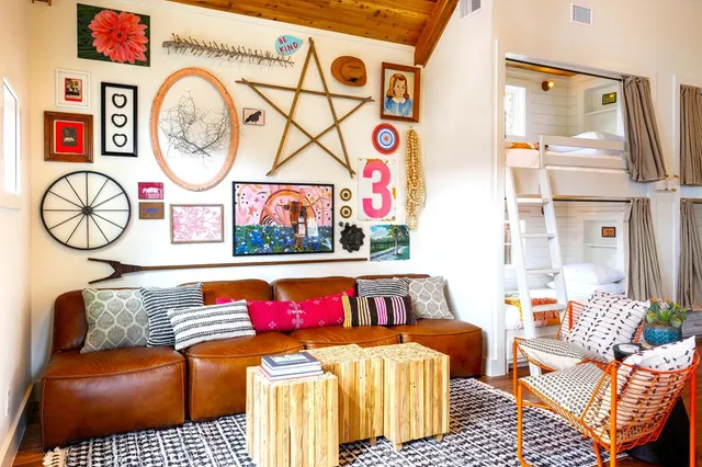 a kitchen with a table chairs refrigerator and microwave