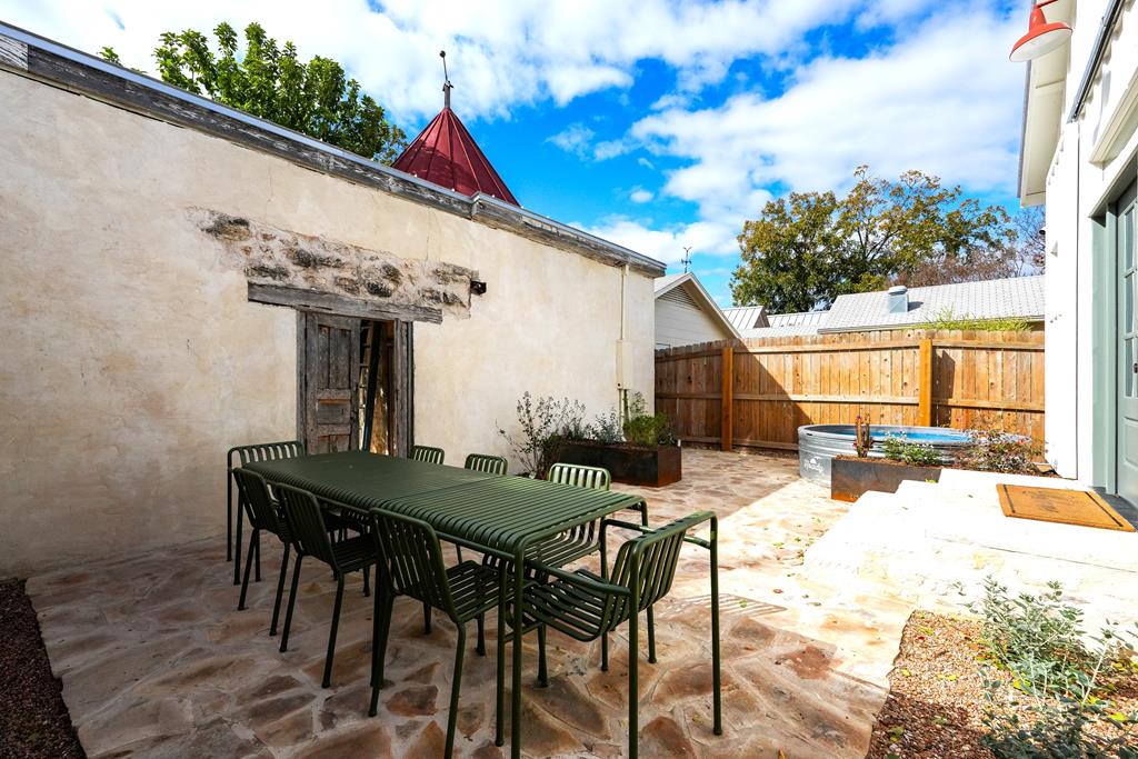 632-636 High Street Comfort, TX 78013 - Photo 41 of 56 a view of a dinning table and chairs in the patio