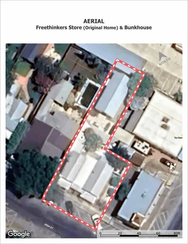 a view of a patio with a table and chairs