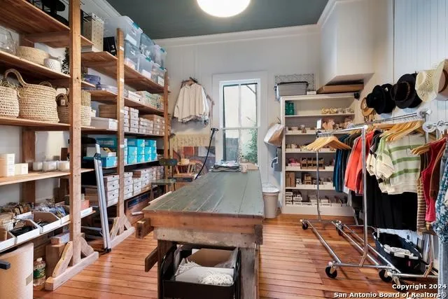 a workspace with furniture and wooden floor