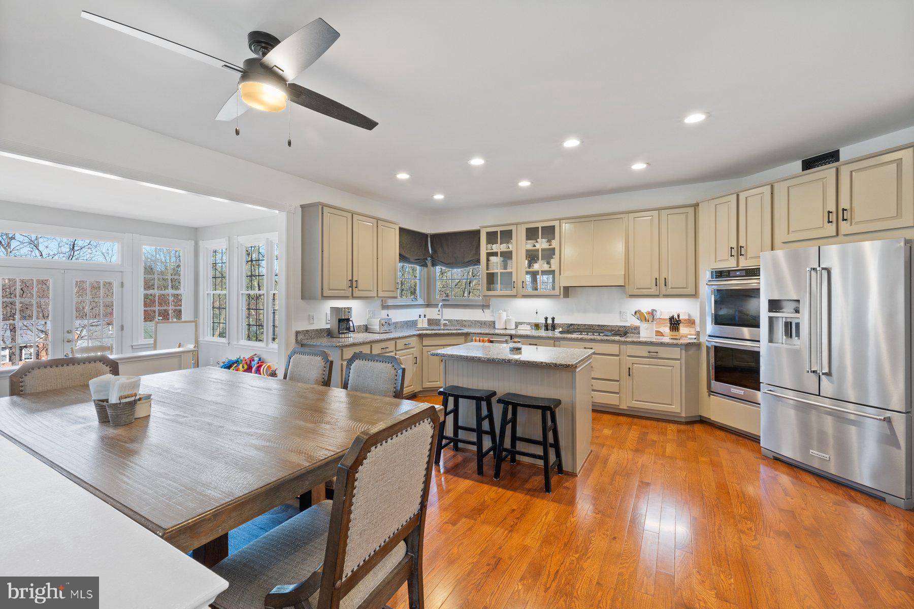 20623 Cutwater Place Sterling, VA 20165 - Photo 24 of 59 a kitchen with a center island appliances and cabinets