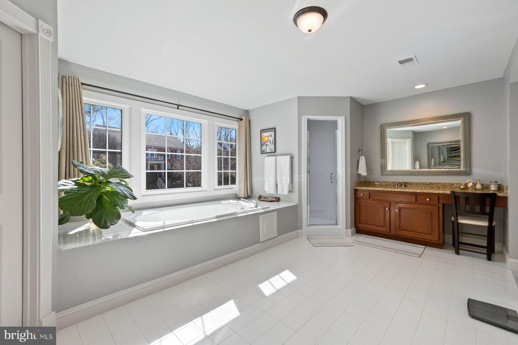 20623 Cutwater Place Sterling, VA 20165 - Photo 30 of 59 a spacious bathroom with a tub double sink and mirror