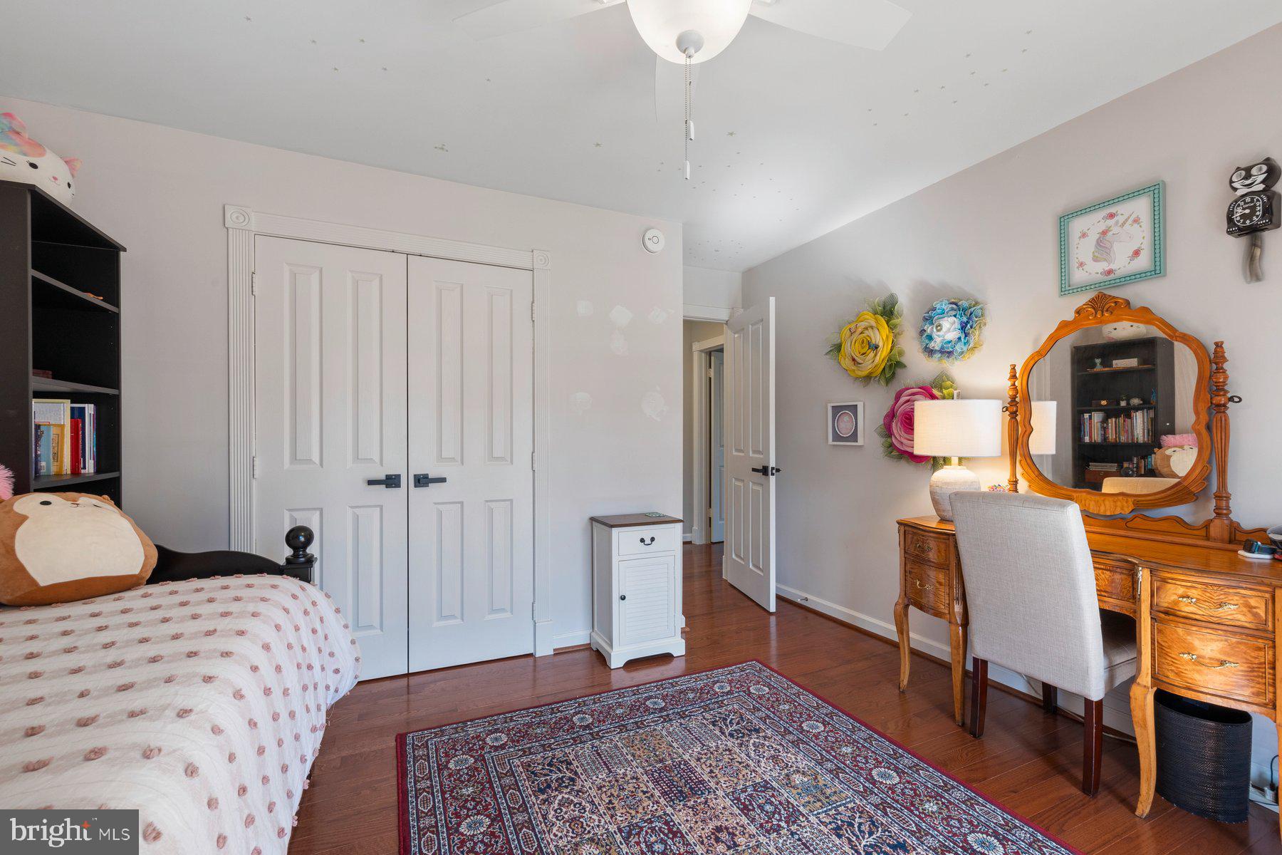 20623 Cutwater Place Sterling, VA 20165 - Photo 33 of 59 a bedroom with a bed and a dresser in it