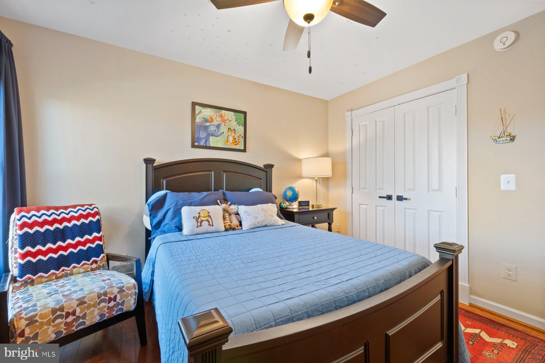 20623 Cutwater Place Sterling, VA 20165 - Photo 35 of 59 a bedroom with a bed and a chandelier