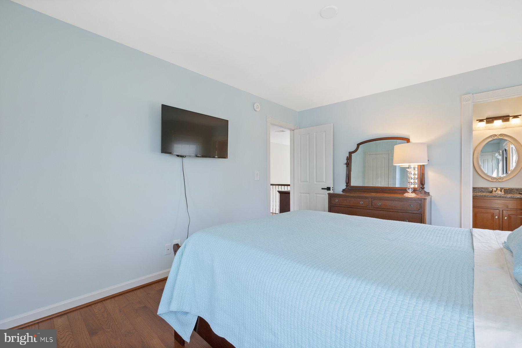 20623 Cutwater Place Sterling, VA 20165 - Photo 37 of 59 a bedroom with a bed and a flat screen tv