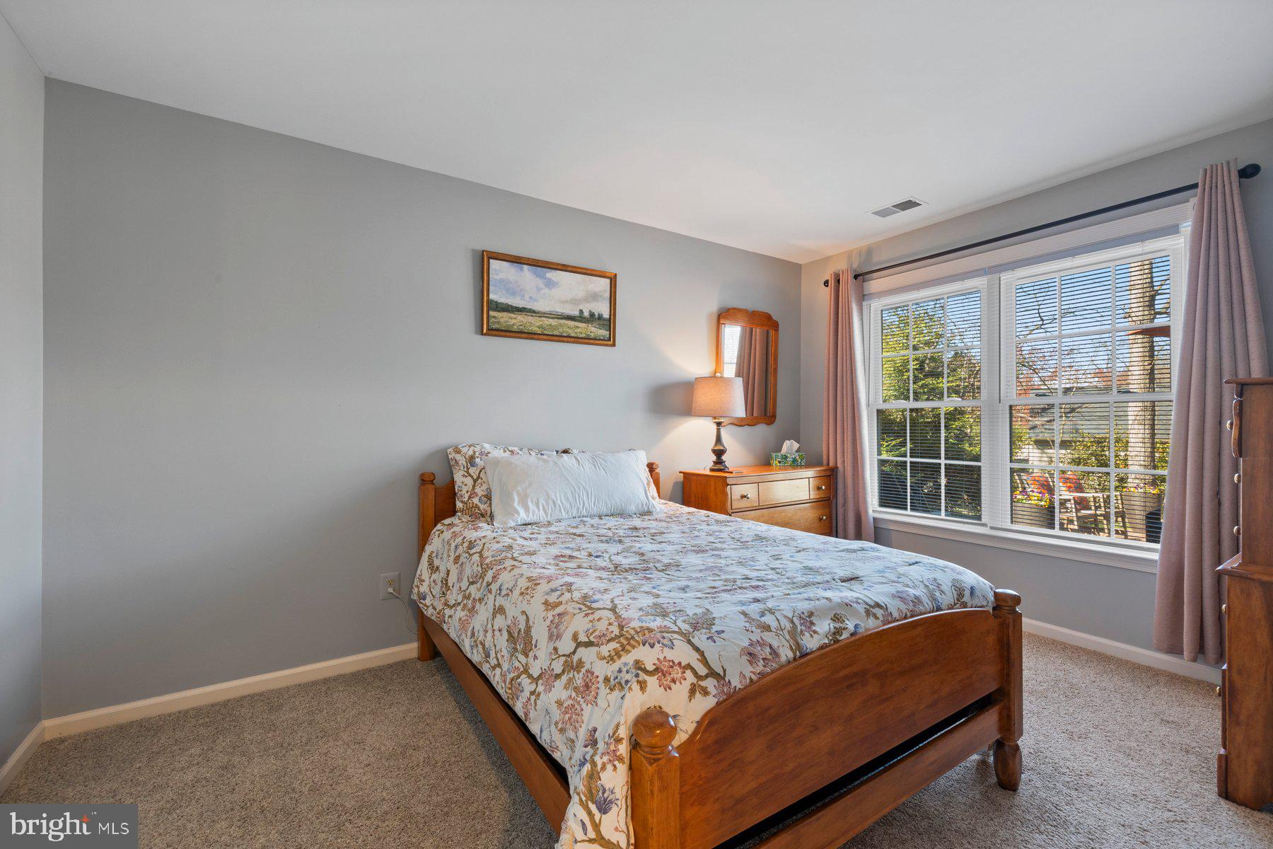 20623 Cutwater Place Sterling, VA 20165 - Photo 46 of 59 a bed sitting in a bedroom next to a window