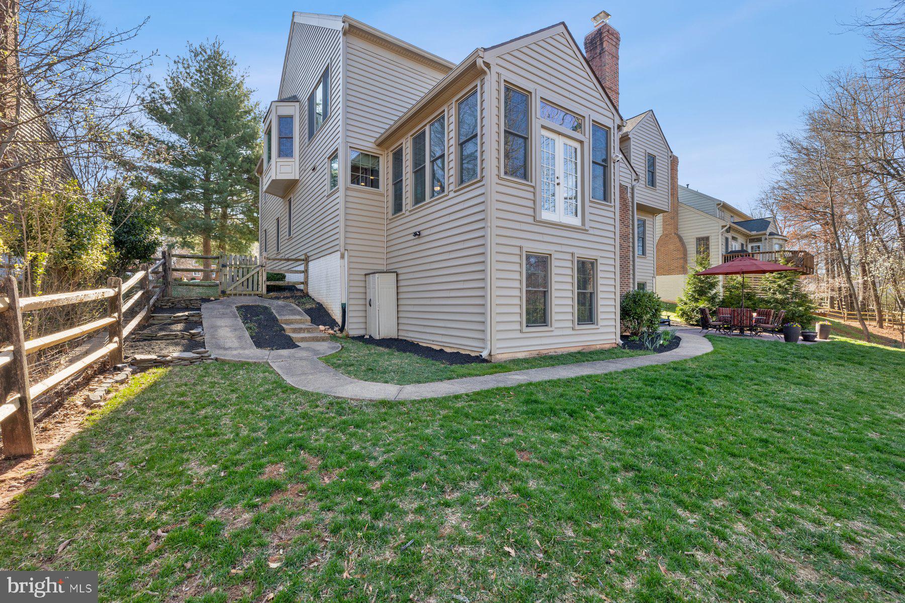 20623 Cutwater Place Sterling, VA 20165 - Photo 56 of 59 a front view of house with yard and green space