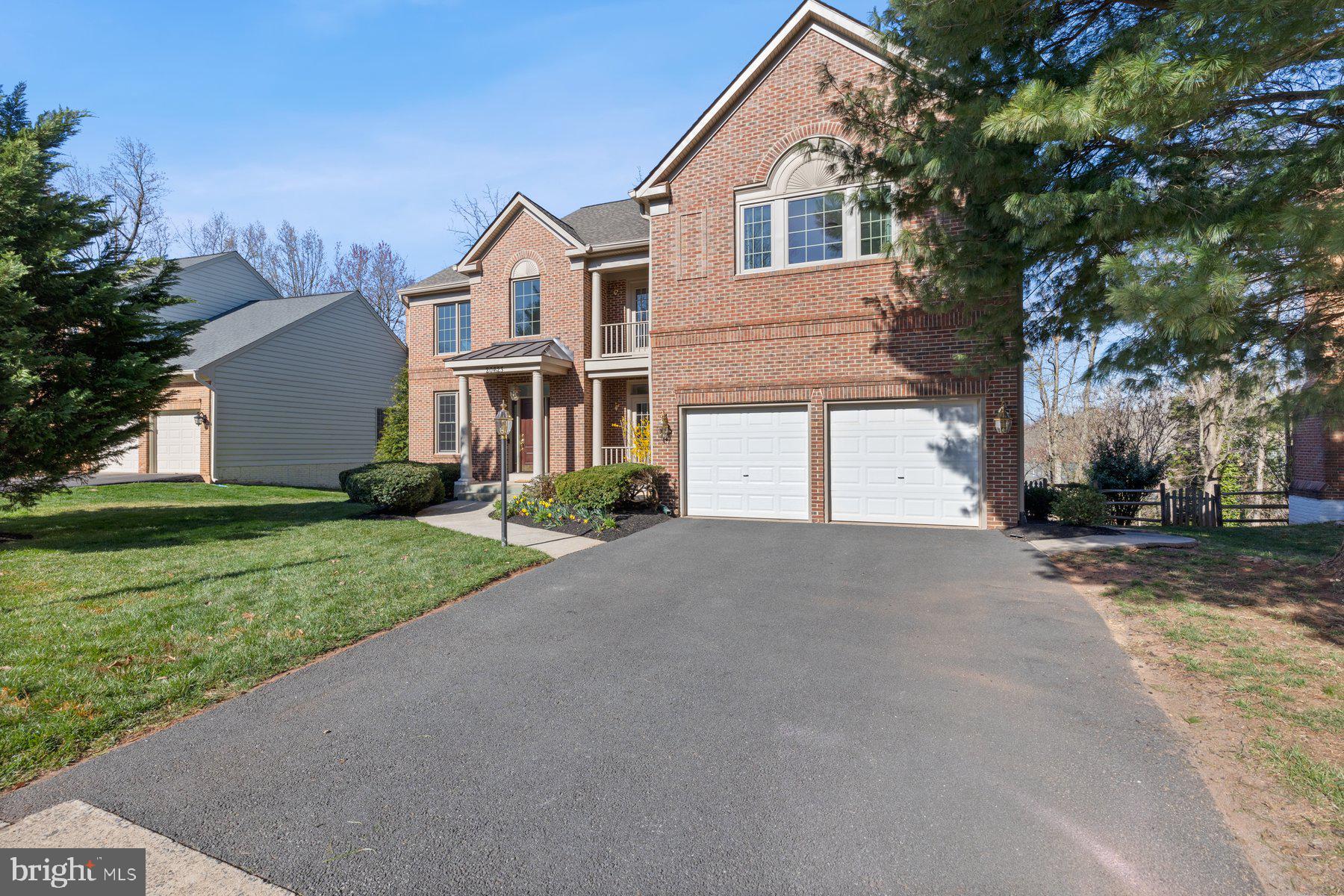 20623 Cutwater Place Sterling, VA 20165 - Photo 59 of 59 a front view of a house with a yard and garage