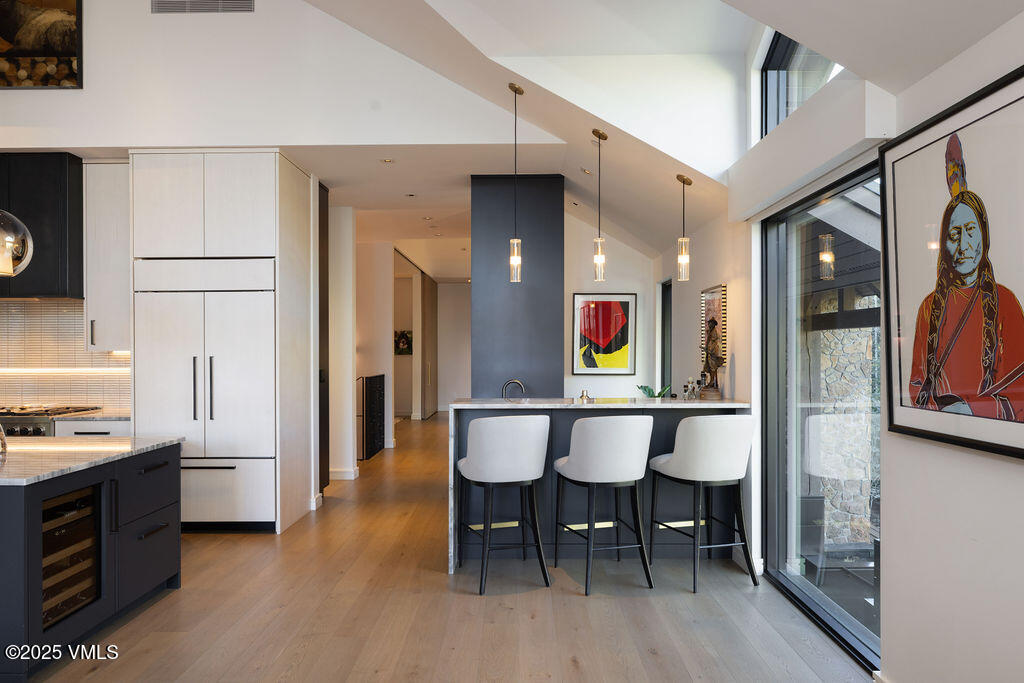 254 Beaver Dam Road Vail, CO 81657 - Photo 13 of 46 a large kitchen with a table and chairs