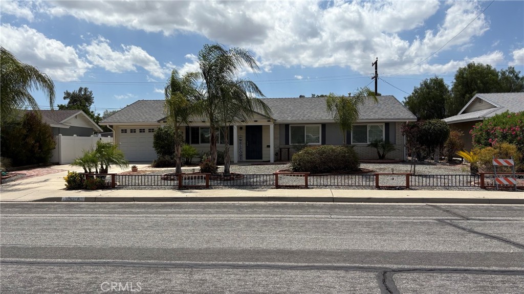 26378 Ridgemoor Road Menifee, CA 92586 - Photo 1 of 20 a front view of a house with a yard