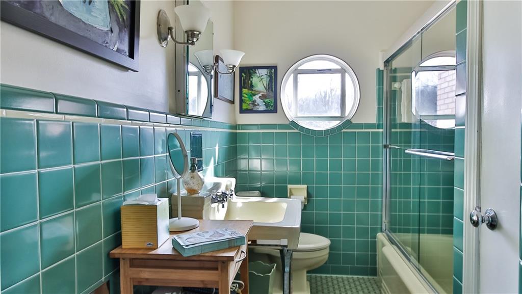 172 Mayfair Drive Pittsburgh, PA 15228 - Photo 13 of 25 a view of a bathroom with a sink and a mirror