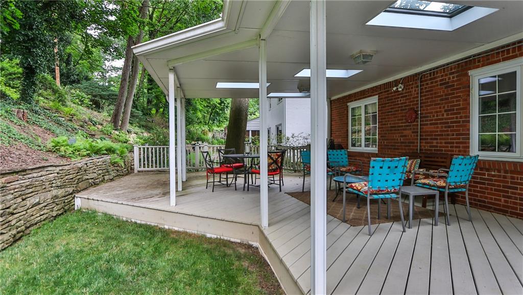 172 Mayfair Drive Pittsburgh, PA 15228 - Photo 24 of 25 a view of a patio with a table chairs and a backyard