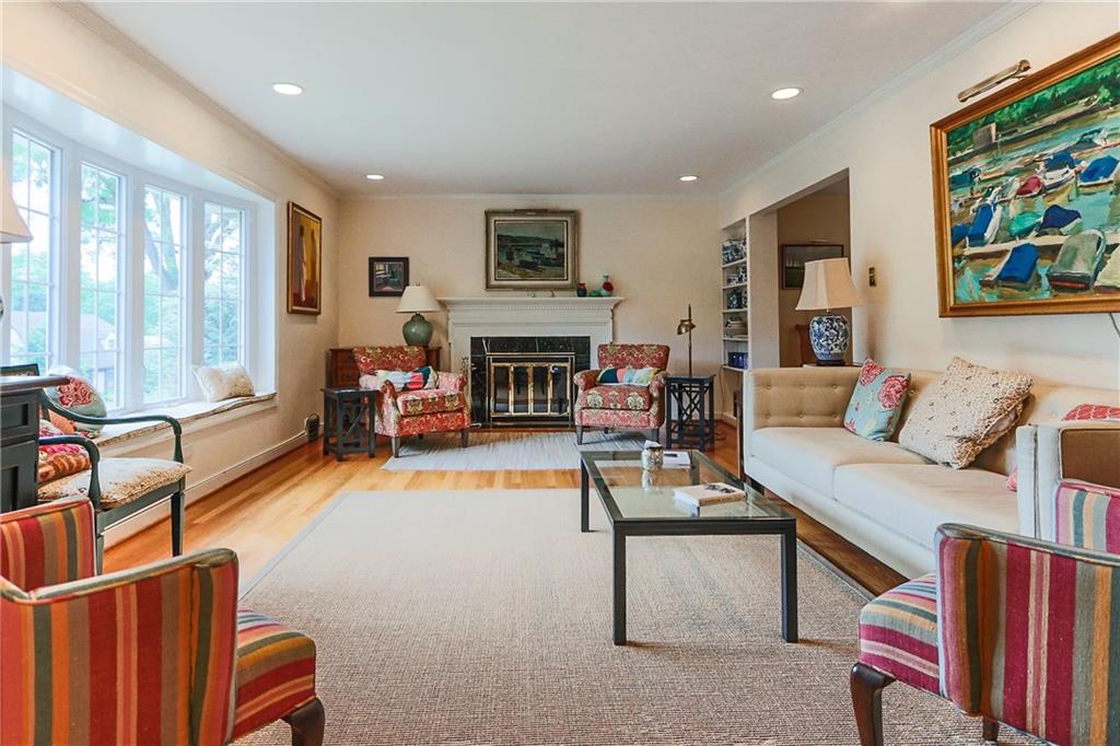 172 Mayfair Drive Pittsburgh, PA 15228 - Photo 4 of 25 a living room with furniture a fireplace and a large window