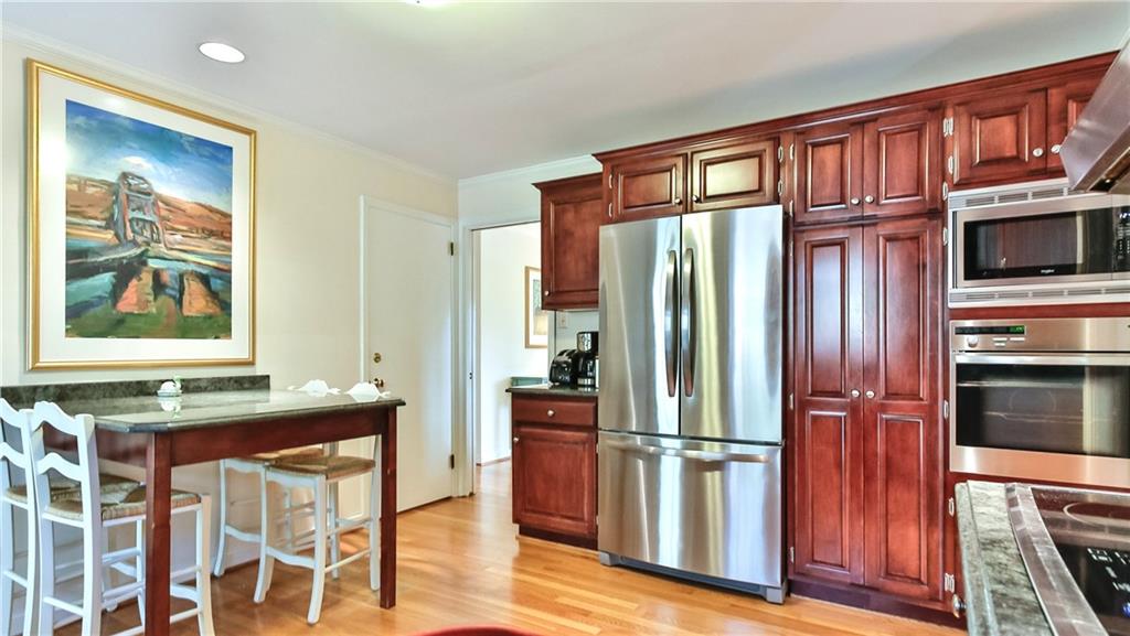 172 Mayfair Drive Pittsburgh, PA 15228 - Photo 7 of 25 a kitchen with stainless steel appliances granite countertop a refrigerator and a stove top oven