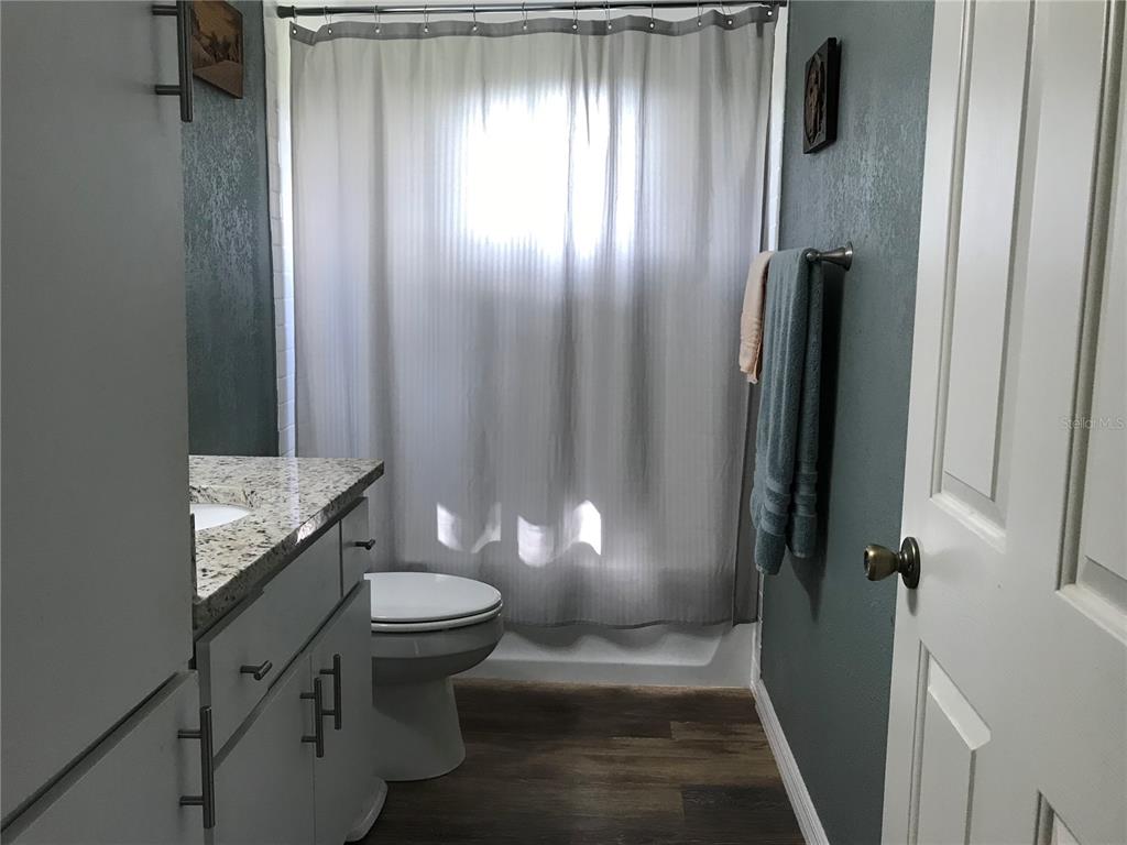 11879 Southwest 137th Loop Dunnellon, FL 34432 - Photo 20 of 37 a bathroom with a sink toilet and shower