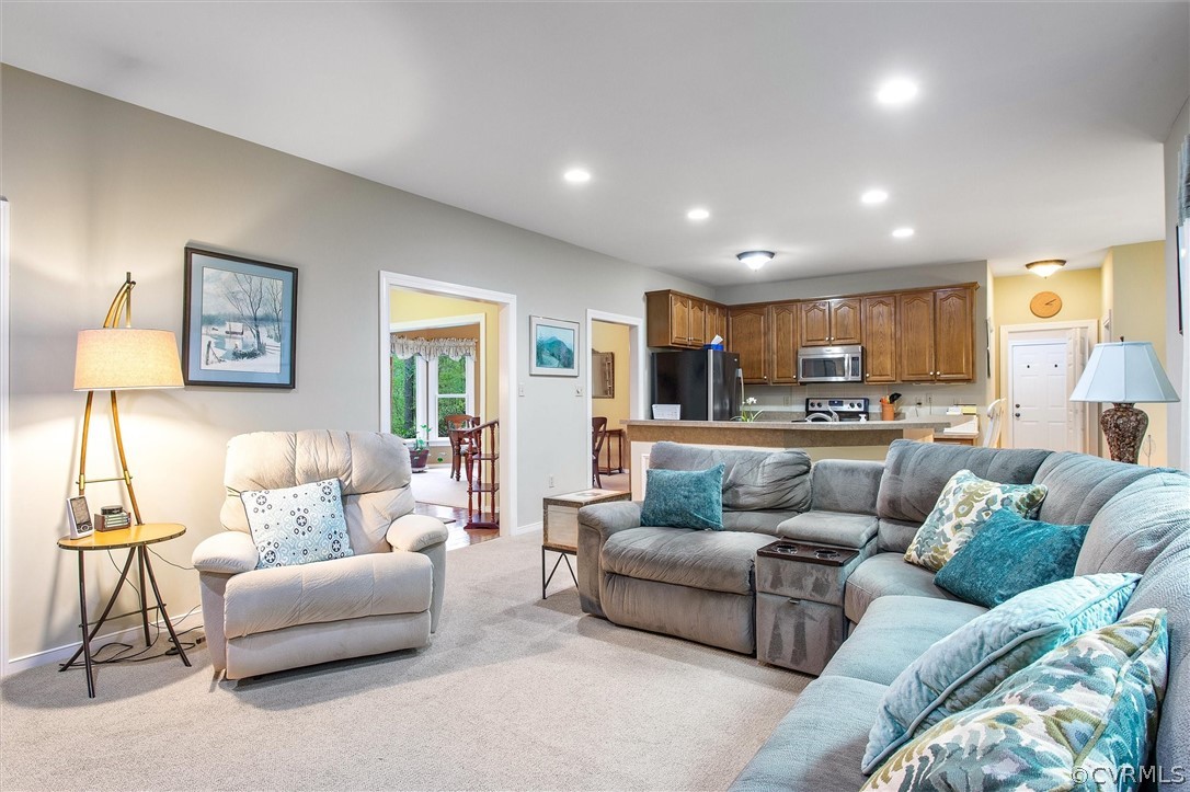 2763 Checketts Drive Sandy Hook, VA 23153 - Photo 11 of 36 a living room with furniture and a view of kitchen
