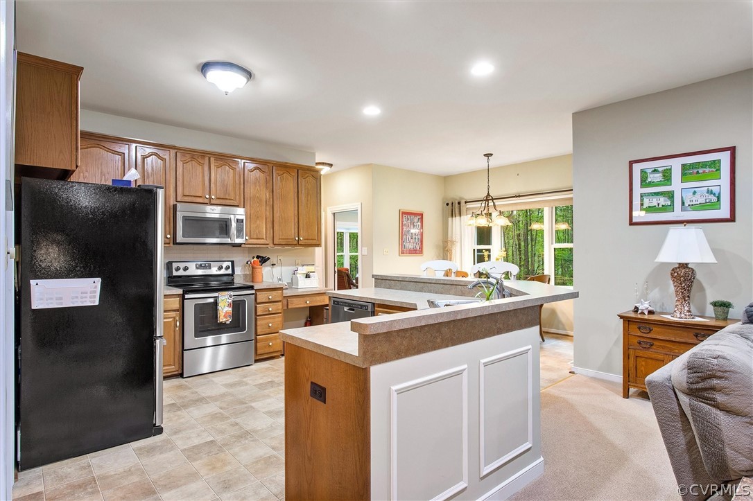 2763 Checketts Drive Sandy Hook, VA 23153 - Photo 12 of 36 a kitchen with a sink stove and refrigerator