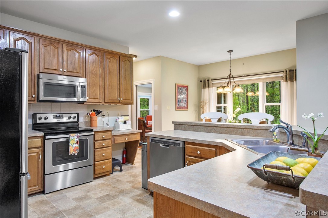 2763 Checketts Drive Sandy Hook, VA 23153 - Photo 13 of 36 a kitchen with stainless steel appliances granite countertop wooden cabinets a sink and a stove