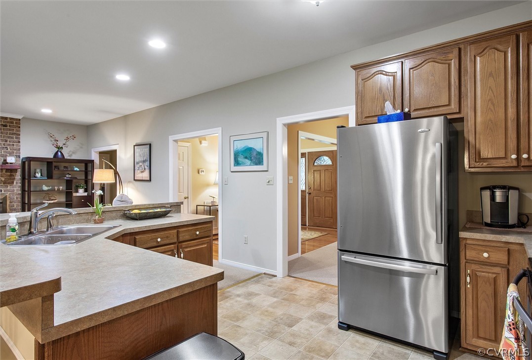 2763 Checketts Drive Sandy Hook, VA 23153 - Photo 15 of 36 a kitchen with stainless steel appliances granite countertop a refrigerator and a stove top oven
