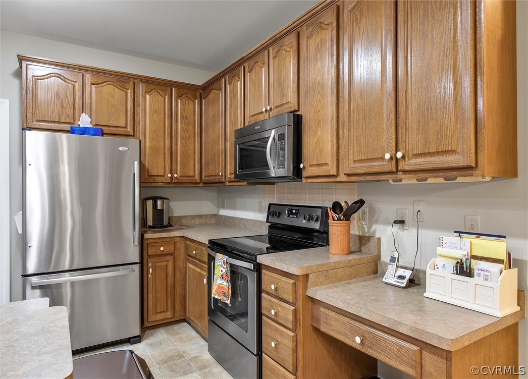 2763 Checketts Drive Sandy Hook, VA 23153 - Photo 16 of 36 a kitchen with stainless steel appliances granite countertop a refrigerator stove a sink and dishwasher