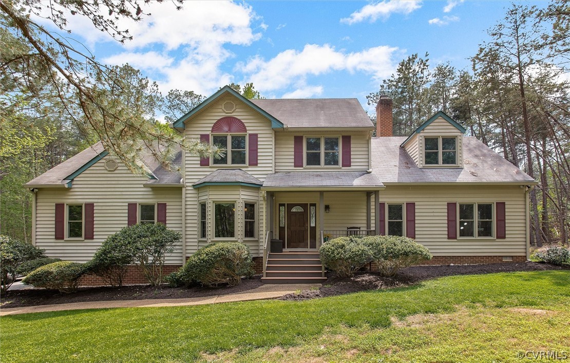 2763 Checketts Drive Sandy Hook, VA 23153 - Photo 2 of 36 a front view of a house with a yard