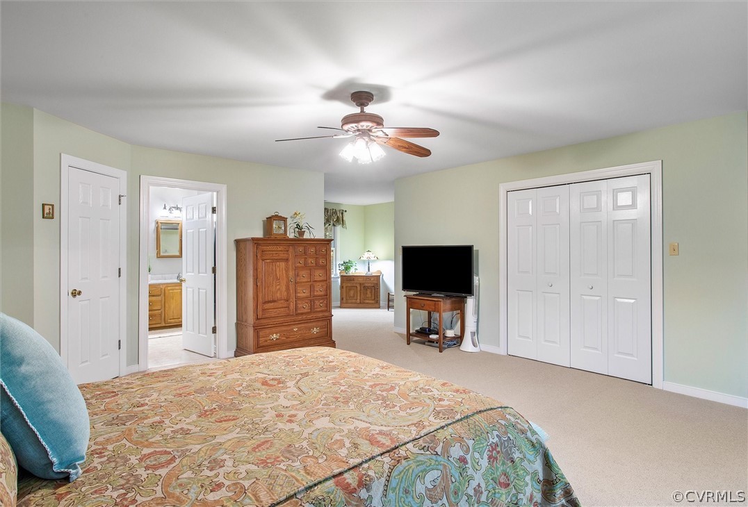 2763 Checketts Drive Sandy Hook, VA 23153 - Photo 27 of 36 a bedroom with a bed and a flat tv screen on dresser