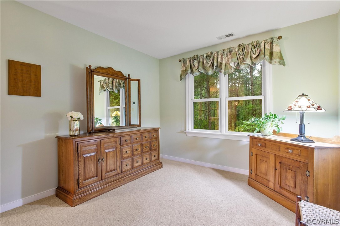 2763 Checketts Drive Sandy Hook, VA 23153 - Photo 28 of 36 a spacious bathroom with a bathtub a sink and a large window