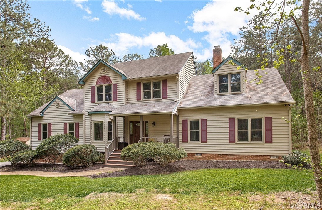 2763 Checketts Drive Sandy Hook, VA 23153 - Photo 3 of 36 a front view of a house with a yard