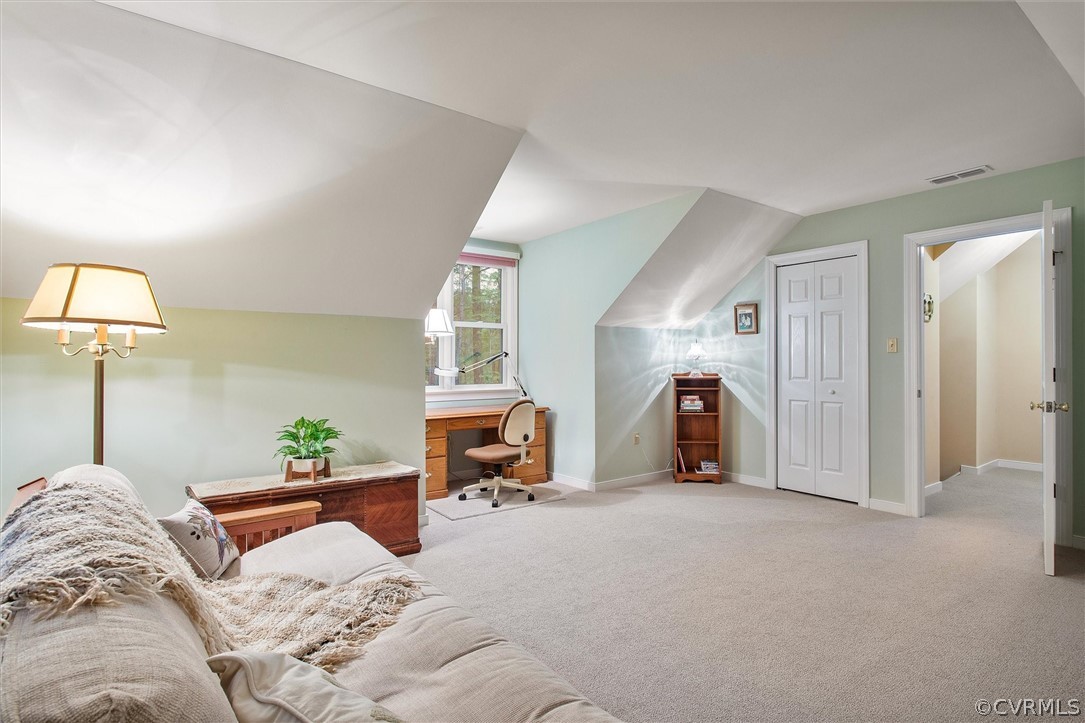 2763 Checketts Drive Sandy Hook, VA 23153 - Photo 31 of 36 a bedroom with furniture and a lamp