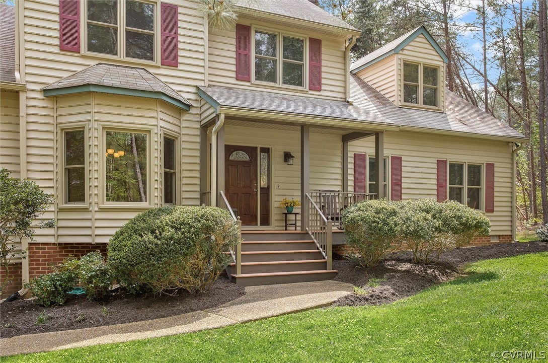 2763 Checketts Drive Sandy Hook, VA 23153 - Photo 4 of 36 a view of a house with brick walls and a yard