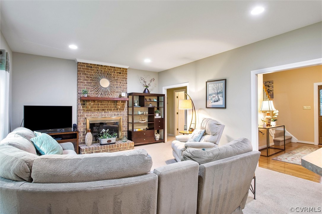 2763 Checketts Drive Sandy Hook, VA 23153 - Photo 9 of 36 a living room with fireplace furniture and a flat screen tv