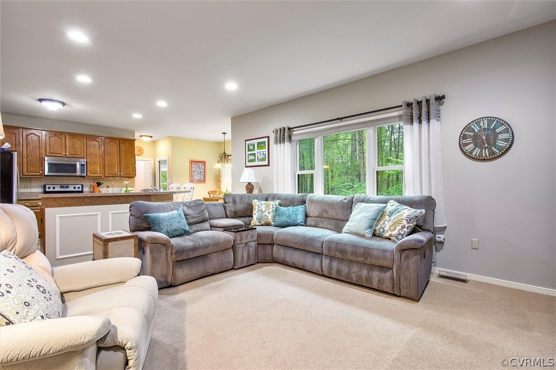 2763 Checketts Drive Sandy Hook, VA 23153 - Photo 10 of 36 a living room with furniture and a large window