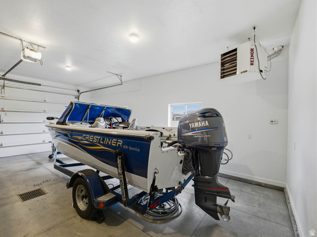 402 Shadow Hill Road Wanship, UT 84017 - Photo 64 of 90 Garage with a heating unit and a garage door opener