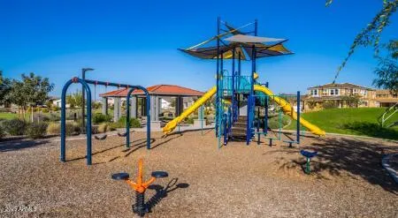 a view of a swimming pool with a table and chairs