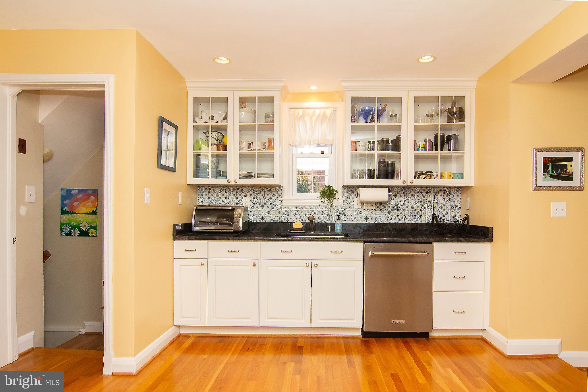 636 Overbrook Road Baltimore, MD 21212 - Photo 11 of 38 a kitchen with granite countertop a sink and cabinets