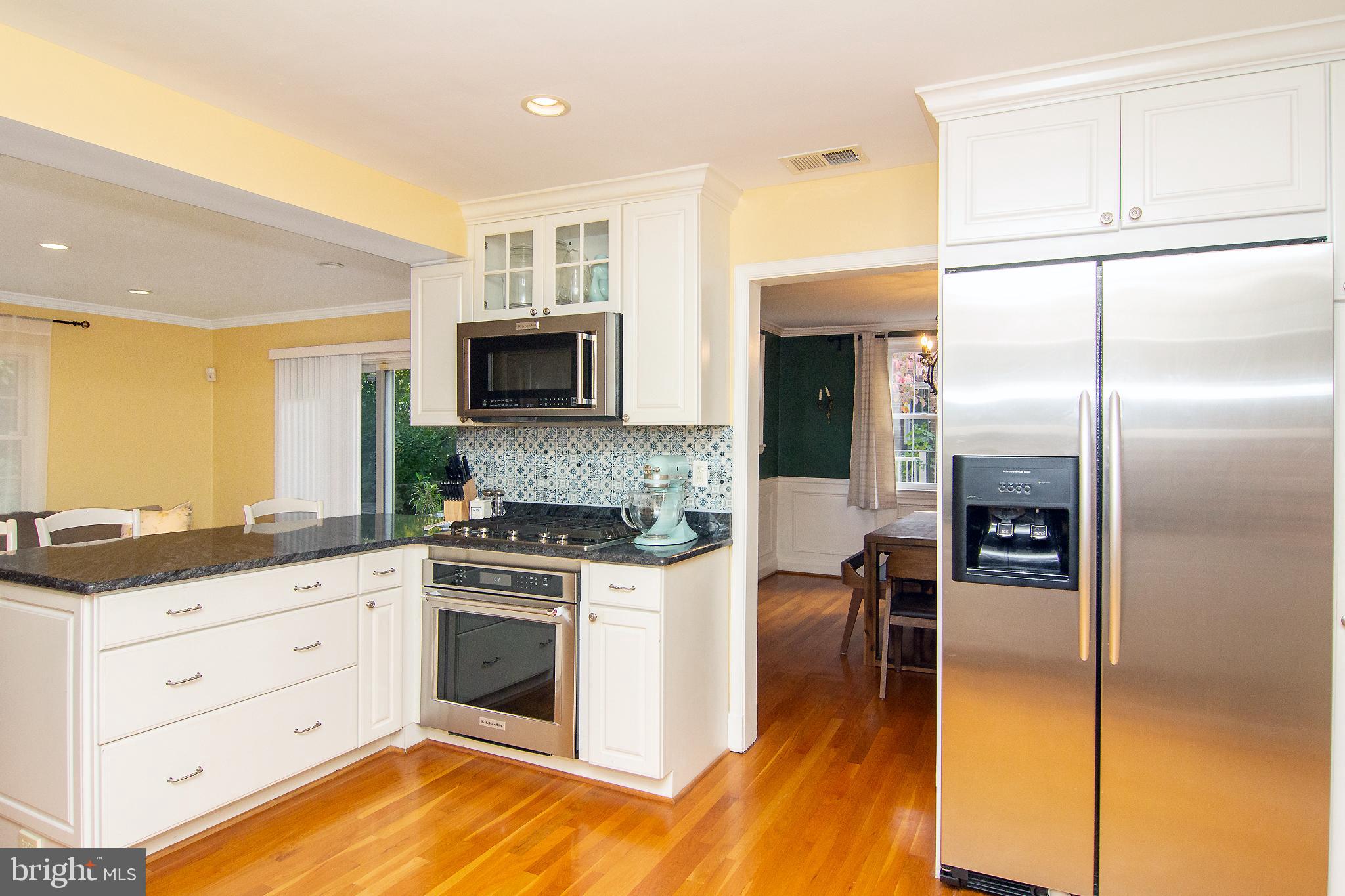 636 Overbrook Road Baltimore, MD 21212 - Photo 13 of 38 a kitchen with stainless steel appliances granite countertop a refrigerator a stove and a microwave