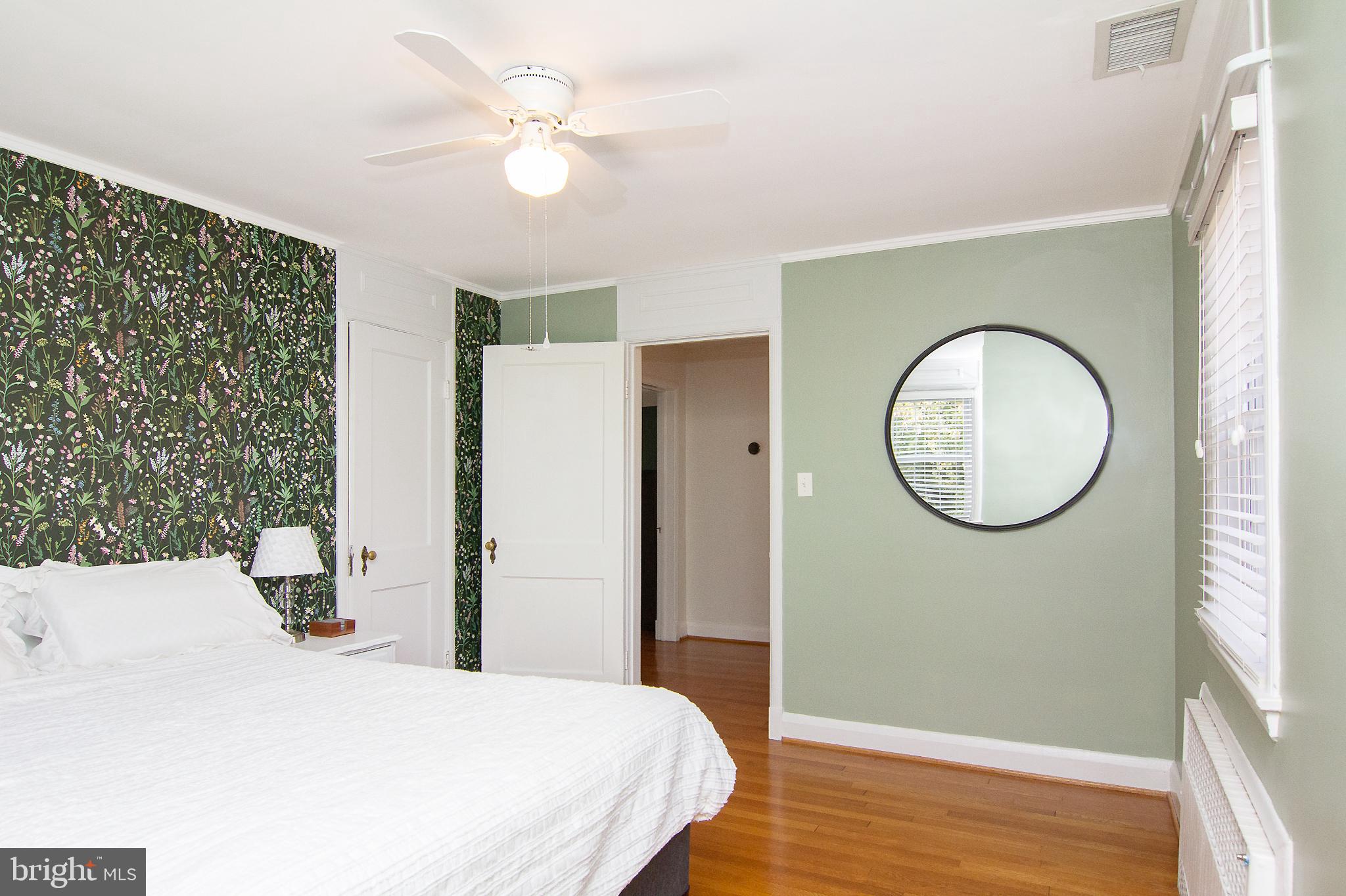 636 Overbrook Road Baltimore, MD 21212 - Photo 23 of 38 a bedroom with a bed mirror and a window