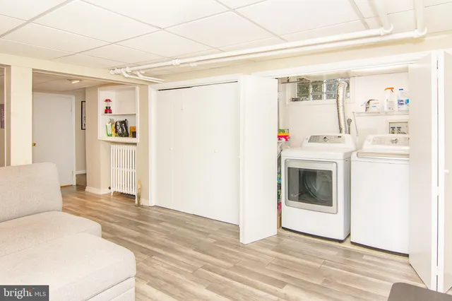 a view of kitchen with furniture and wooden floor