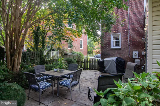 a view of a patio filled with furniture
