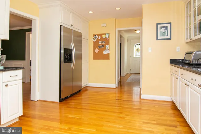 a view of a kitchen cabinets and wooden floor