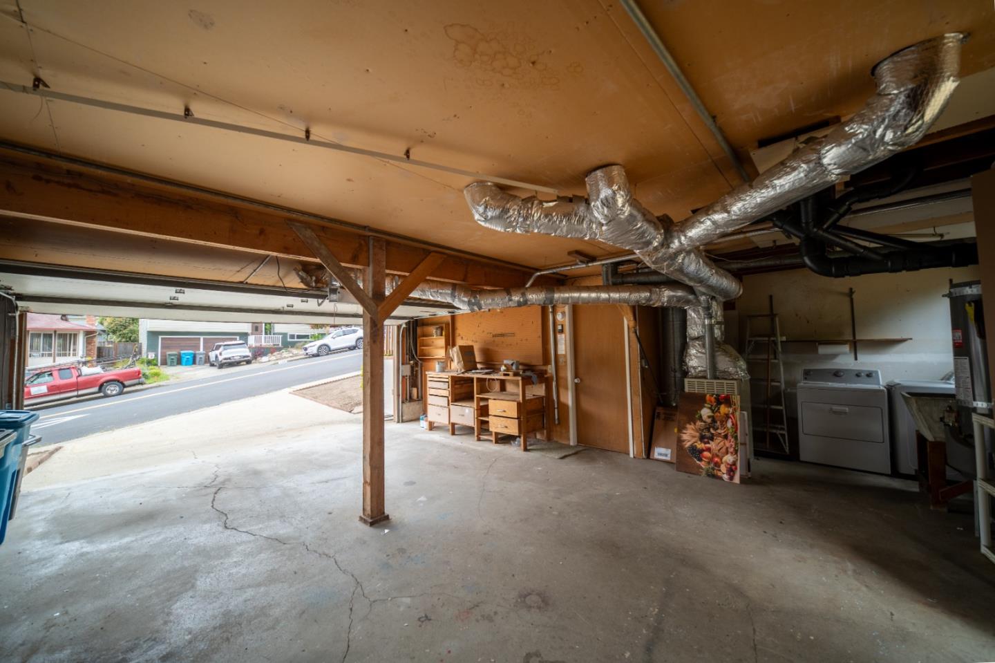 1287 Lerida Way Pacifica, CA 94044 - Photo 50 of 52 a view of a garage with wooden shelves