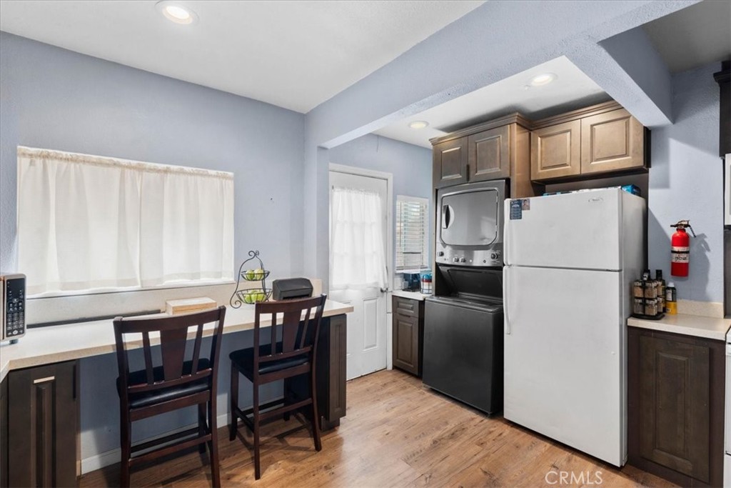 3974 5th Street Riverside, CA 92501 - Photo 16 of 45 a kitchen with stainless steel appliances granite countertop a refrigerator and a stove top oven