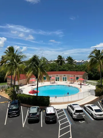 a view of swimming pool with seating area and city view