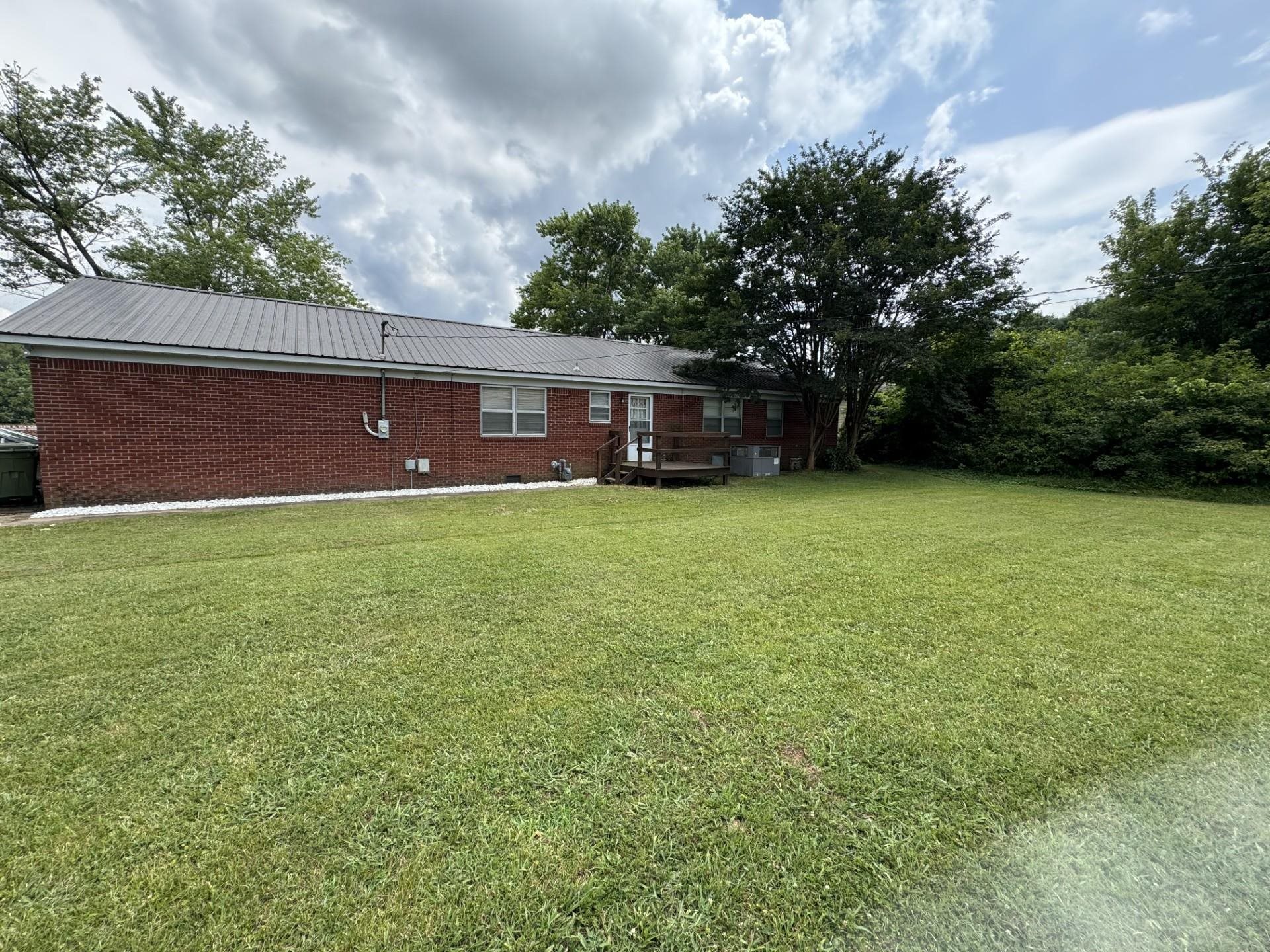 2631 Highway 51 Ripley, TN 38063 - Photo 16 of 17 Back of house featuring a yard and a metal roof