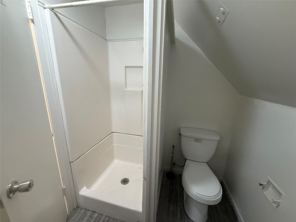 622 Trinity Street Lockhart, TX 78644 - Photo 12 of 16 a bathroom with a toilet and a shower